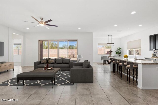 11856 W Lone Tree Trl, Peoria, AZ 85383 - living area with light tile patterned floors, recessed lighting, and ceiling fan