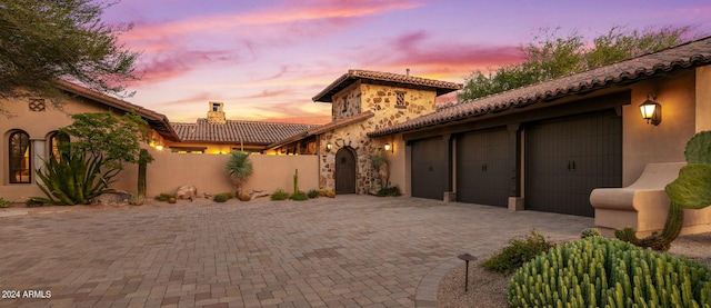 view of front of property with a garage