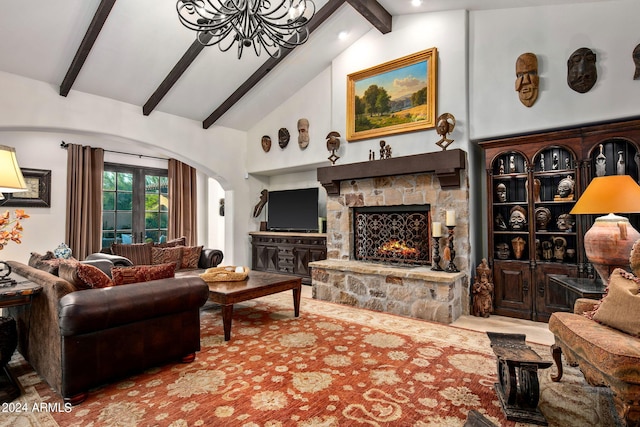 living room with a stone fireplace, beam ceiling, a chandelier, and high vaulted ceiling