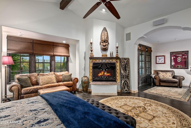 living room with ceiling fan, beamed ceiling, dark hardwood / wood-style floors, and high vaulted ceiling