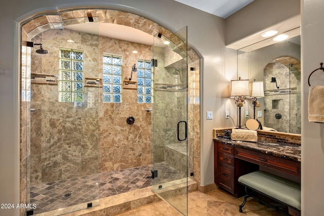 bathroom featuring vanity, tile patterned floors, and an enclosed shower