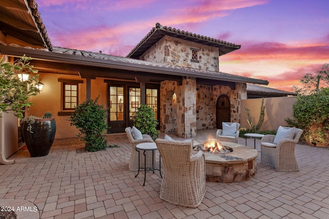 patio terrace at dusk with an outdoor fire pit