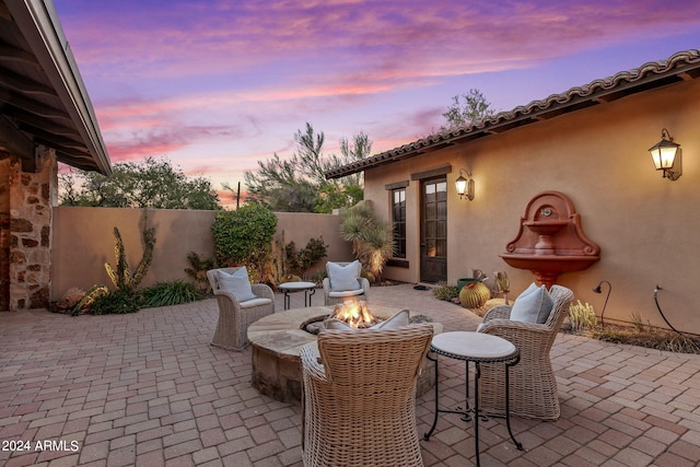 patio terrace at dusk with a fire pit