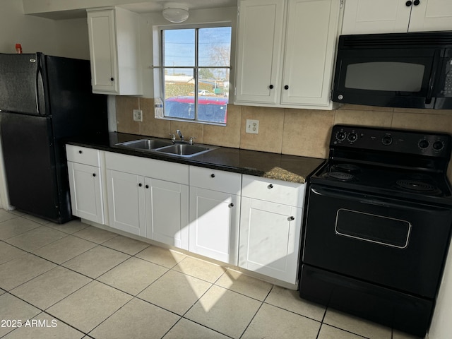 kitchen featuring light tile patterned flooring, sink, black appliances, decorative backsplash, and white cabinets