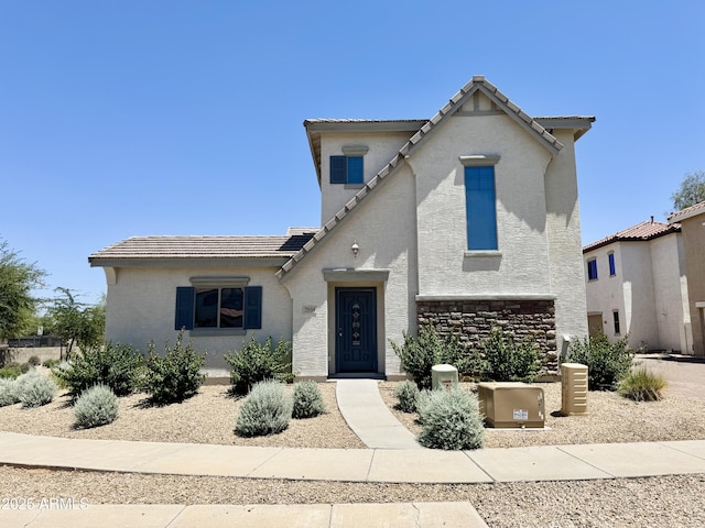 2539 N 148th Dr, Goodyear, AZ 85395 - view of front of house featuring a tiled roof, stucco siding, and stone siding
