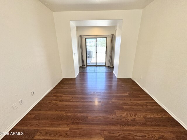 2539 N 148th Dr, Goodyear, AZ 85395 - spare room with dark wood-style flooring and baseboards