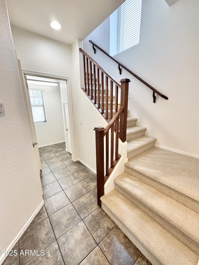 2539 N 148th Dr, Goodyear, AZ 85395 - stairs with tile patterned floors, baseboards, and recessed lighting