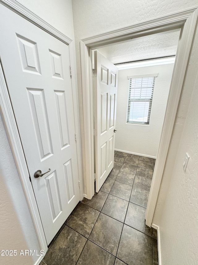 2539 N 148th Dr, Goodyear, AZ 85395 - hallway with tile patterned flooring and a textured wall