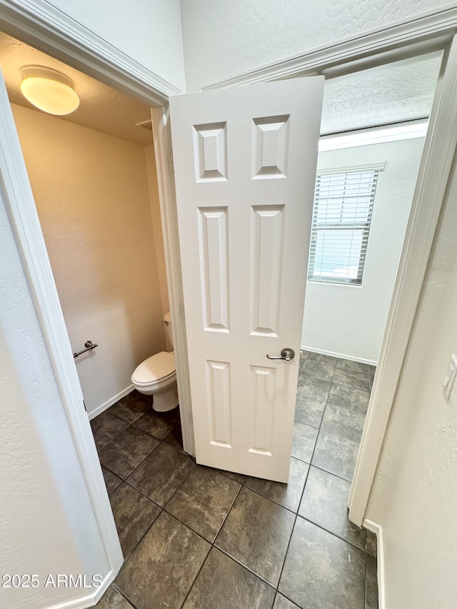 2539 N 148th Dr, Goodyear, AZ 85395 - bathroom with tile patterned flooring, toilet, and baseboards