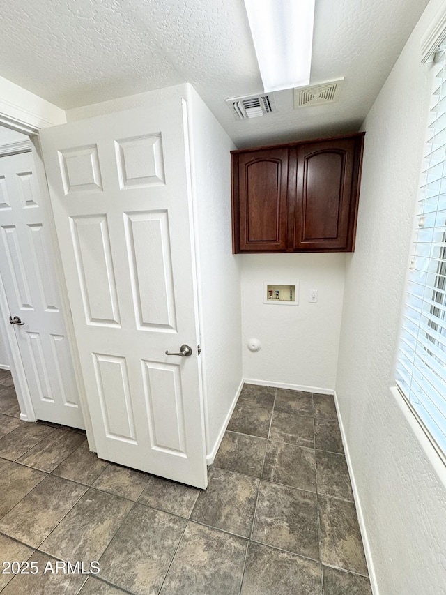 2539 N 148th Dr, Goodyear, AZ 85395 - laundry area with cabinet space, washer hookup, baseboards, and a textured ceiling