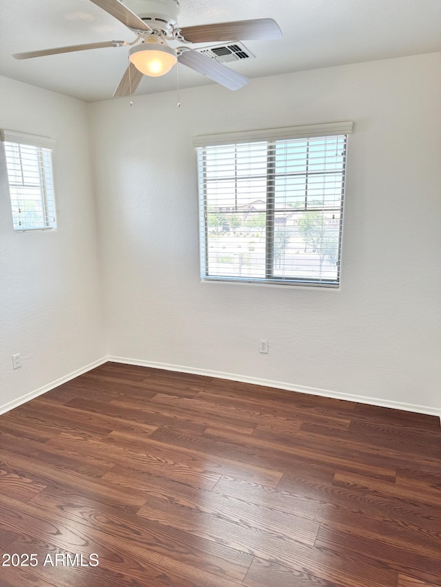 2539 N 148th Dr, Goodyear, AZ 85395 - unfurnished room with wood finished floors, ceiling fan, and baseboards
