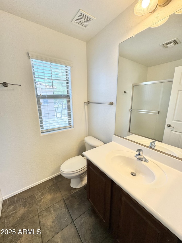 2539 N 148th Dr, Goodyear, AZ 85395 - bathroom featuring a shower stall, toilet, vanity, and baseboards