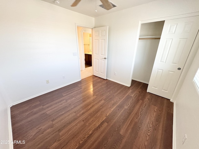 2539 N 148th Dr, Goodyear, AZ 85395 - unfurnished bedroom with dark wood finished floors, a closet, and baseboards