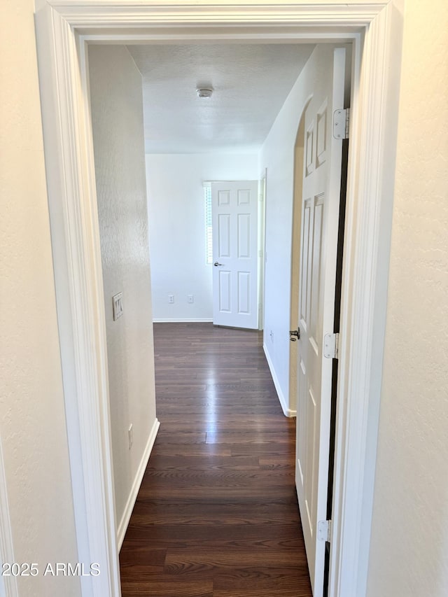2539 N 148th Dr, Goodyear, AZ 85395 - hallway with dark wood-style floors and baseboards