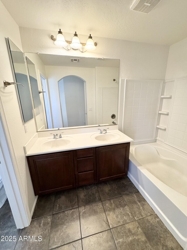 2539 N 148th Dr, Goodyear, AZ 85395 - full bathroom featuring double vanity, a bathtub, and a shower
