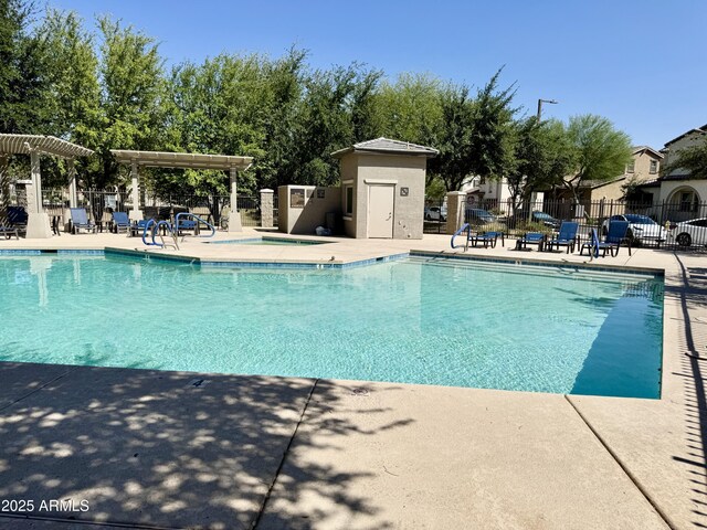 2539 N 148th Dr, Goodyear, AZ 85395 - community pool featuring a patio