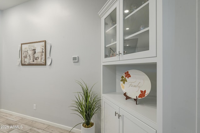 17253 W Echo Ln, Waddell, AZ 85355 - bar area featuring baseboards and light wood-type flooring