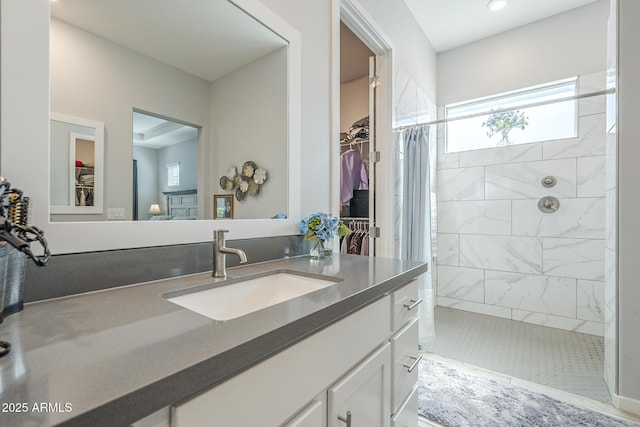 17253 W Echo Ln, Waddell, AZ 85355 - bathroom featuring a walk in shower, vanity, a walk in closet, and recessed lighting