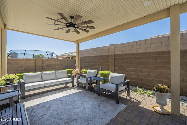 17253 W Echo Ln, Waddell, AZ 85355 - view of patio / terrace featuring an outdoor hangout area, a ceiling fan, and a fenced backyard
