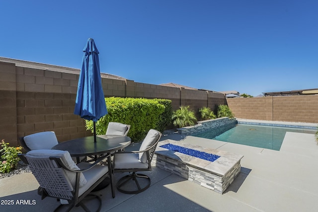 17253 W Echo Ln, Waddell, AZ 85355 - view of swimming pool featuring a fenced backyard, a patio, and outdoor dining space