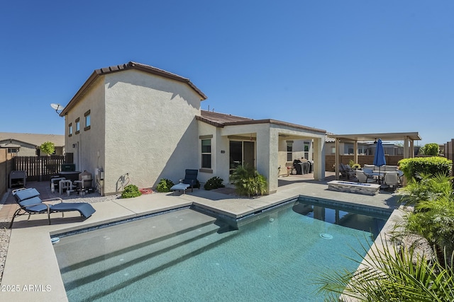 17253 W Echo Ln, Waddell, AZ 85355 - rear view of property featuring stucco siding, a patio, and fence