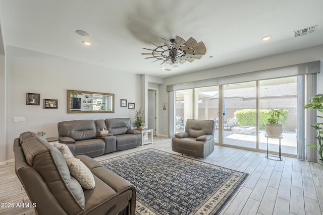 17253 W Echo Ln, Waddell, AZ 85355 - living room featuring wood finished floors, ceiling fan, recessed lighting, and baseboards