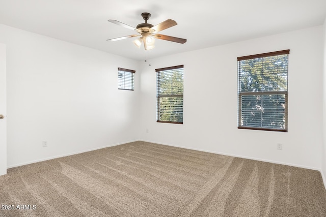 unfurnished room featuring carpet and ceiling fan