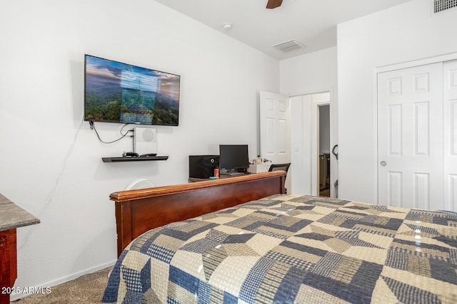 carpeted bedroom with a closet and ceiling fan