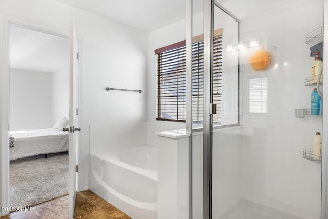 bathroom featuring tile patterned floors and a bath