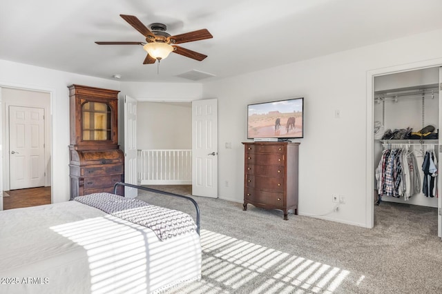 bedroom featuring carpet flooring, ceiling fan, and a closet