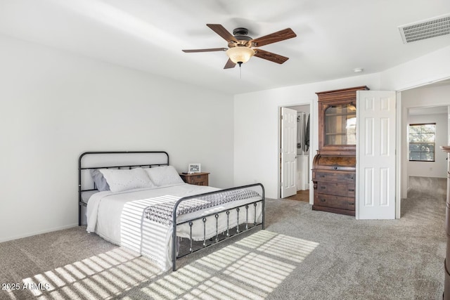 carpeted bedroom featuring ceiling fan