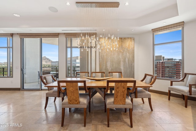 dining area with healthy amount of natural light, baseboards, and recessed lighting