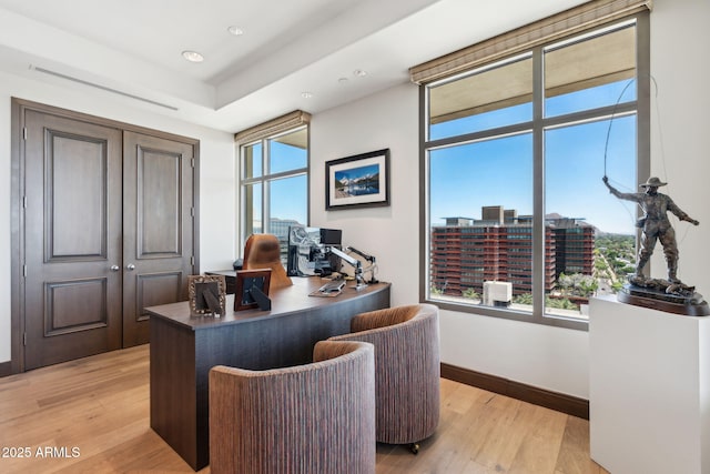 office area with light wood-style floors, baseboards, and recessed lighting