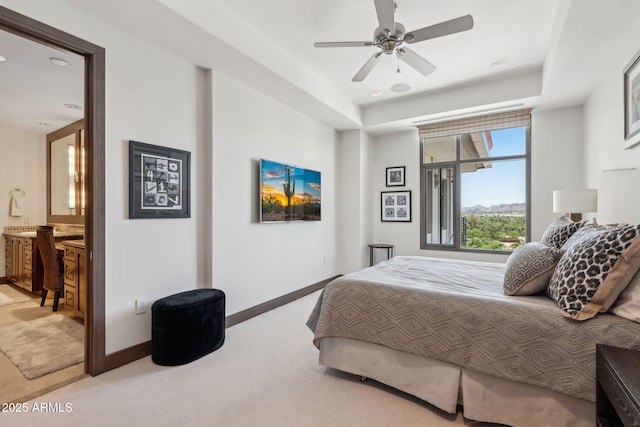 bedroom featuring carpet, baseboards, ensuite bathroom, recessed lighting, and ceiling fan