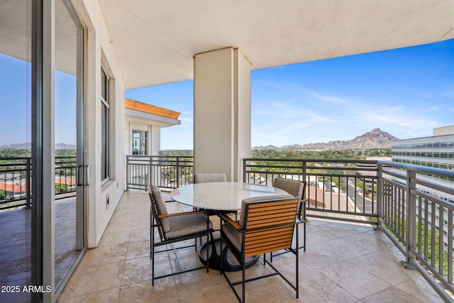 balcony featuring a mountain view