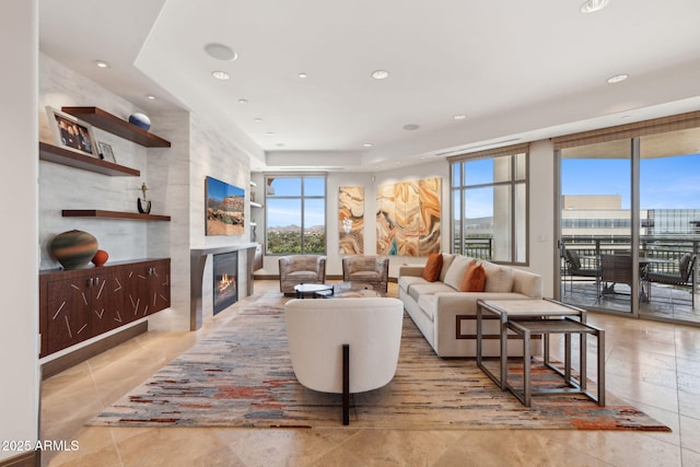 living room with a fireplace, healthy amount of natural light, recessed lighting, and light tile patterned flooring