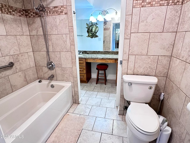 full bathroom with tile patterned flooring, vanity, toilet, and tiled shower / bath