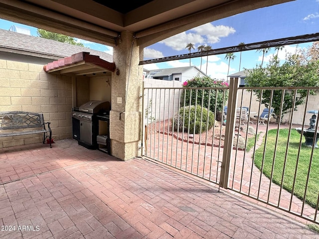 view of patio with a grill