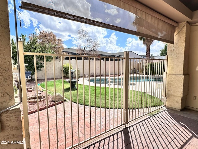 view of patio featuring a fenced in pool