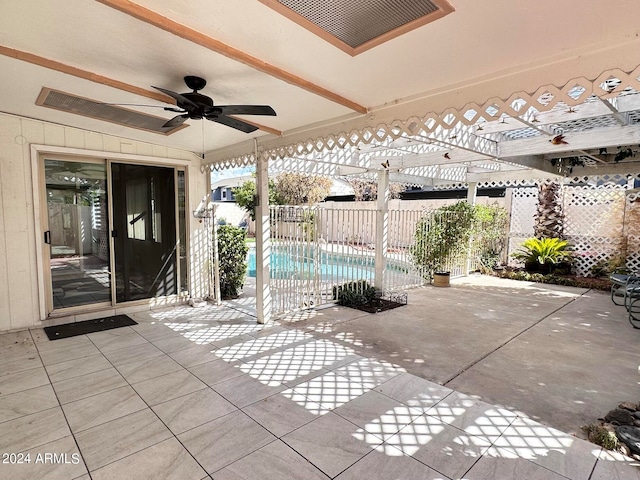 view of patio / terrace with ceiling fan and a pergola