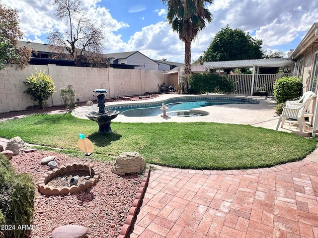 view of pool featuring a yard and a patio area