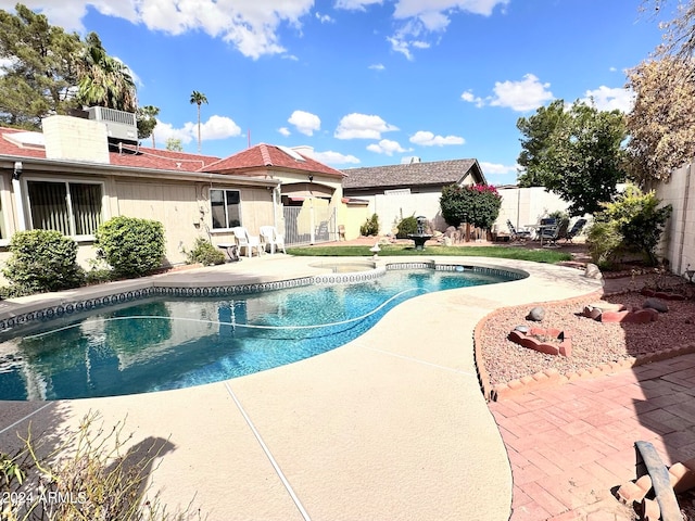 view of swimming pool with a patio area