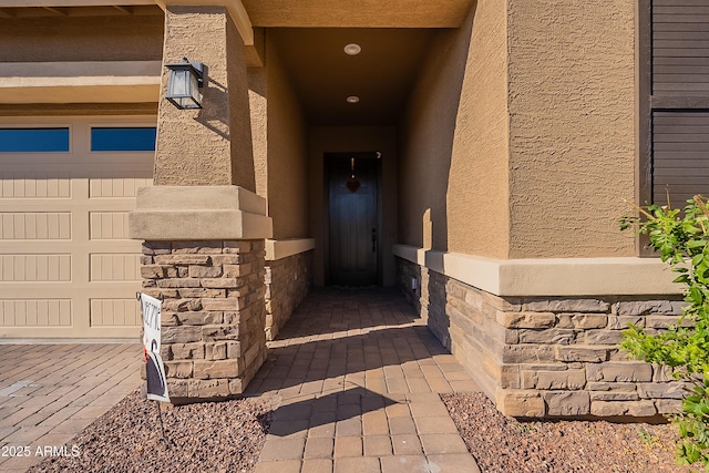 property entrance with a garage