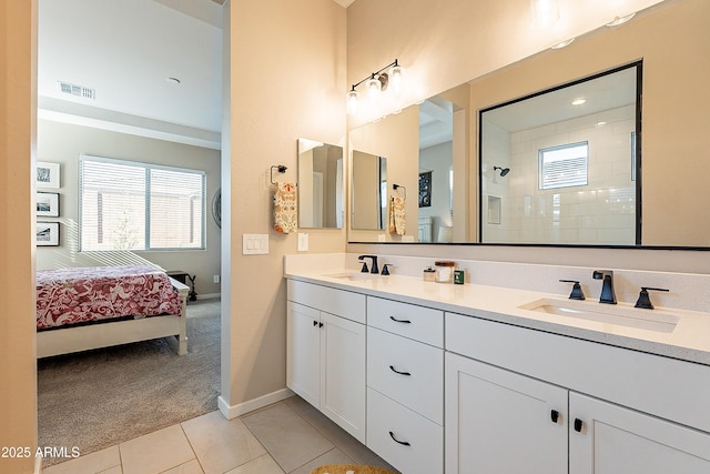 bathroom featuring tile patterned flooring and vanity