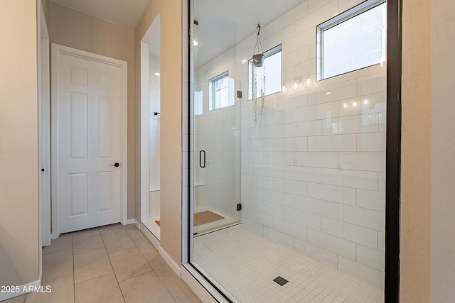 bathroom featuring tile patterned floors and walk in shower