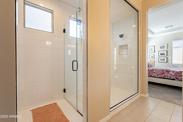 bathroom featuring walk in shower and tile patterned floors