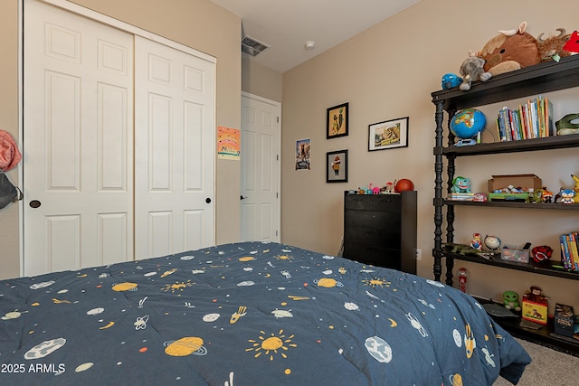 carpeted bedroom with a closet