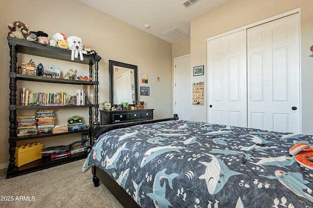 bedroom featuring a closet and light carpet