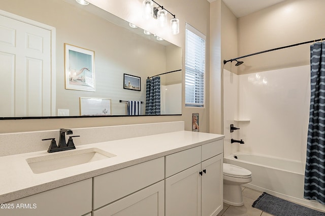 full bathroom featuring vanity, shower / bath combo with shower curtain, tile patterned floors, and toilet