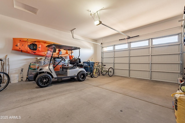 garage featuring a garage door opener